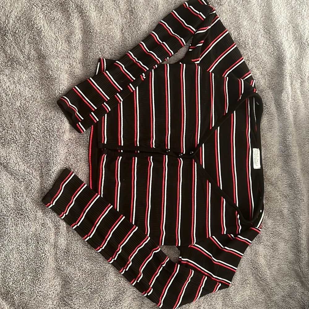 A black with red and white striped crop top